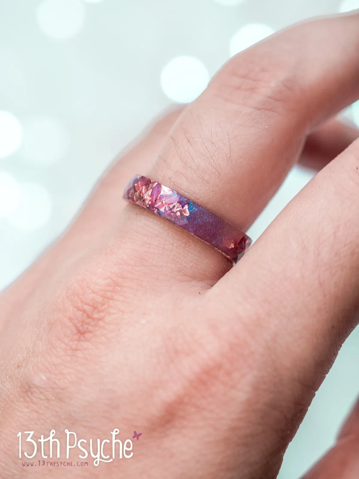 Iridescent pink faceted resin ring with pink metal flakes