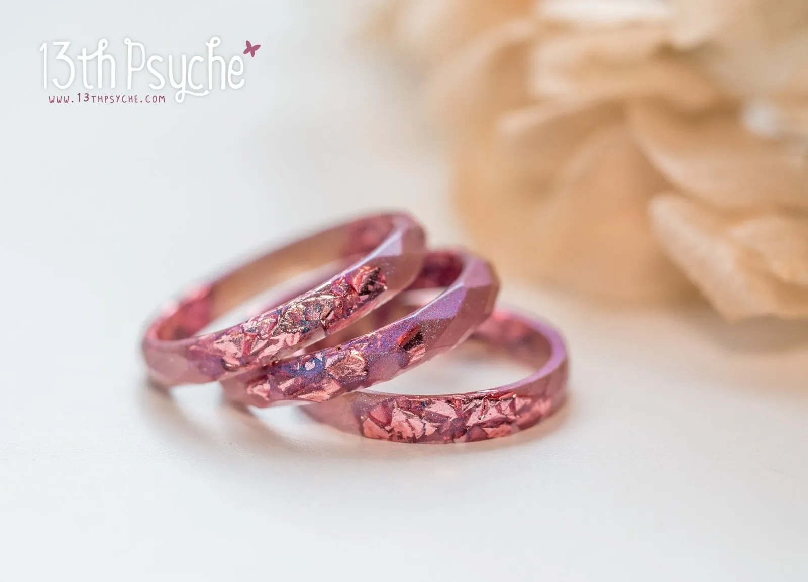 Iridescent pink faceted resin ring with pink metal flakes