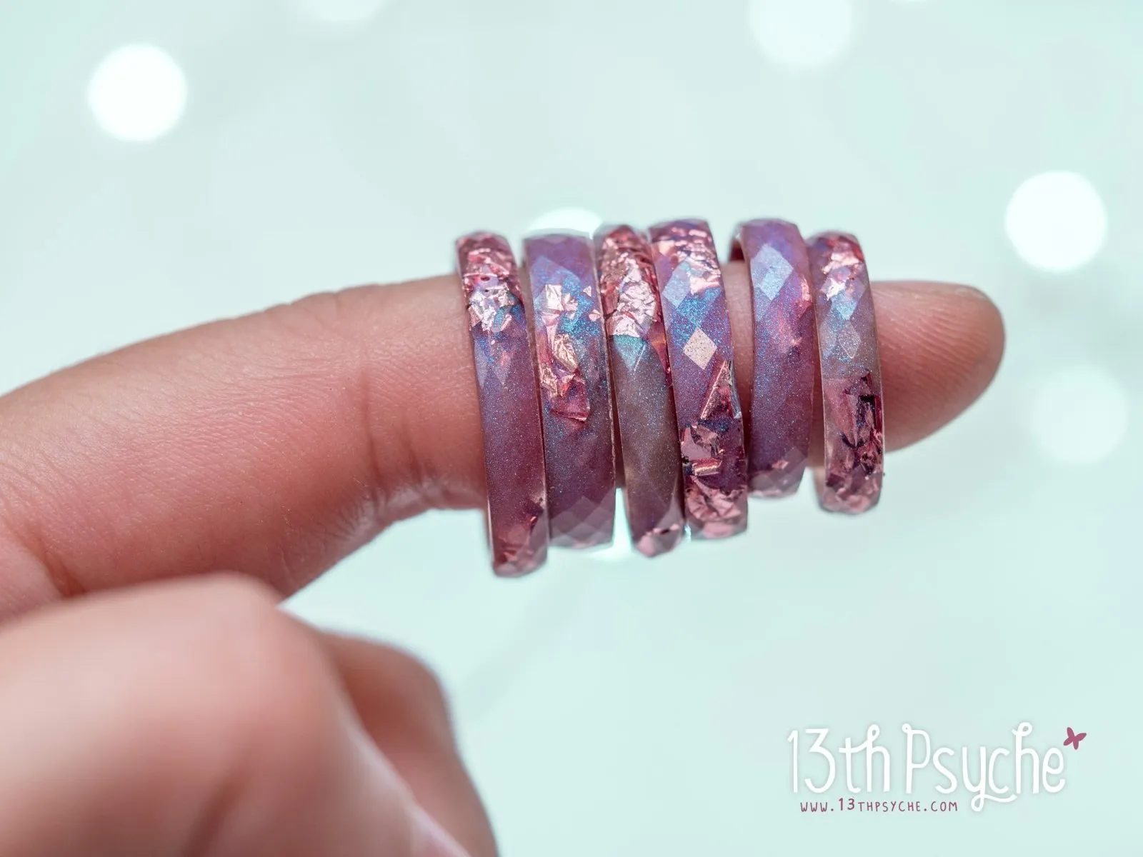 Iridescent pink faceted resin ring with pink metal flakes